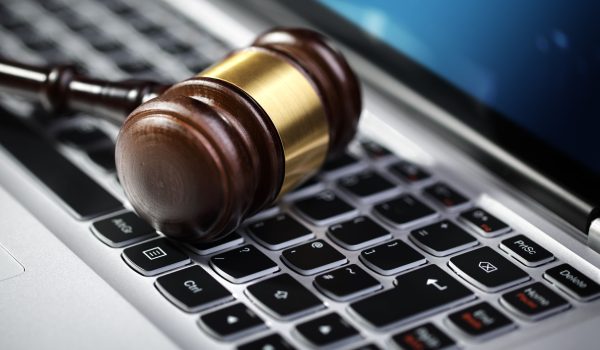 35905375 - gavel on laptop computer keyboard concept for online internet auction or legal assistance